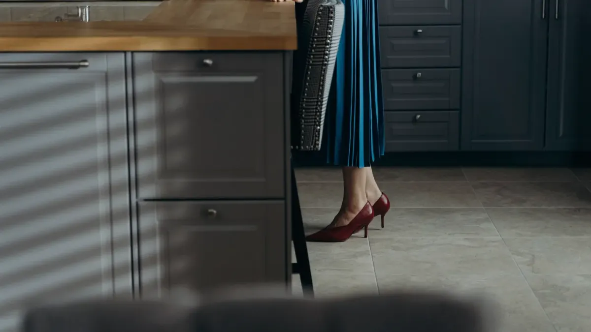 Dog in kitchen with owner
