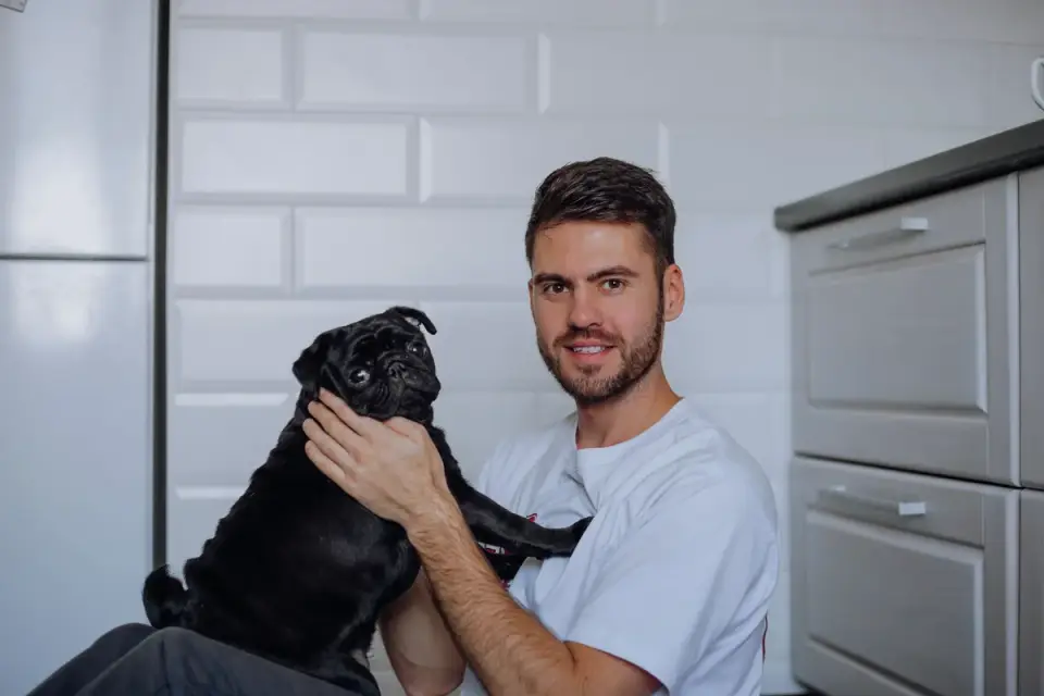 Dog in kitchen with owner