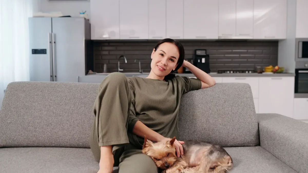 Dog in kitchen with owner