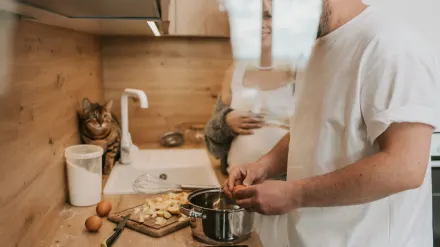 Dog owner preparing a meal