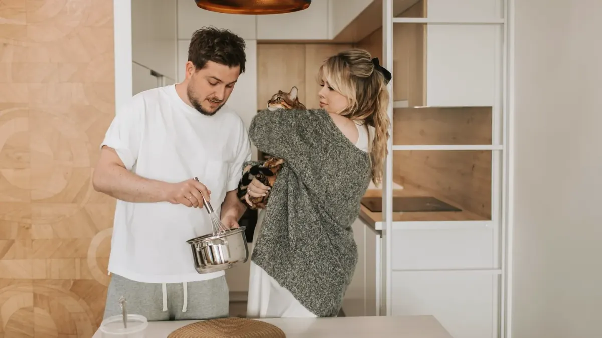 Dog owner preparing dog food kitchen